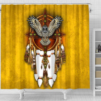 Close-up yellow shower curtain with owl dreamcatcher graphic and hanging tassels