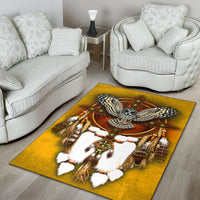 Yellow owl dreamcatcher area rug with white feathers, brown oval ring, and colorful accents