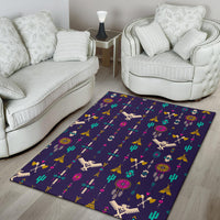 Wonder Print Shop Thunderbird pattern area rug in dark purple/blue with colorful motifs