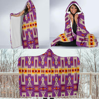 Front-view hooded blanket with purple and orange geometric pattern, hood up and wrapped