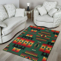 Green native-style rug with red and yellow diamond patterns on light wood floor