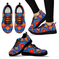 Multicolor geometric sneakers with black sole and red/orange/blue pattern, lace-up.