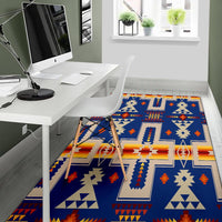 Navy tribal design rug with cream, red and orange geometric shapes