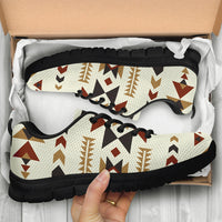Boxed aztec sneakers close-up, cream geometric print with black sole