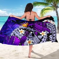 Purple sarong with turtle, pineapple/leaf motifs and white flowers, black edging