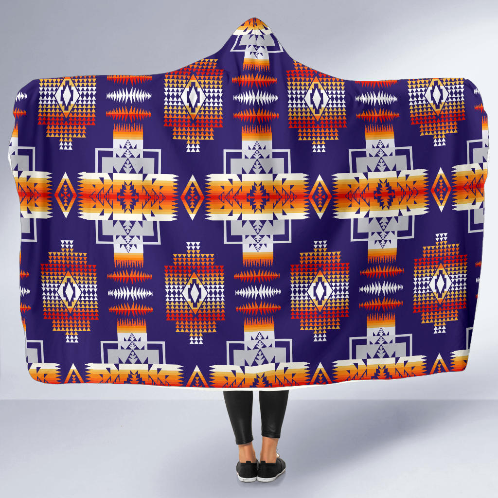 Purple hooded blanket with all-over geometric motifs in orange, white, and blue tones
