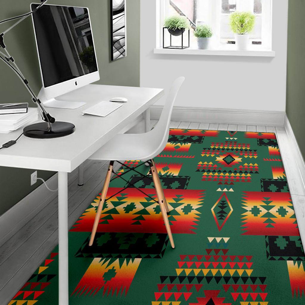 Green area rug with red, yellow, and black tribal geometric print in home office