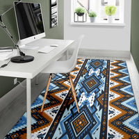 Blue tribal area rug with orange accents, zigzags, crosses and framed square designs