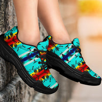 Turquoise Native American patterned chunky sneakers, black sole, worn side view