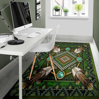 Green native area rug featuring beadwork medallion, turquoise oval accents, and woven border