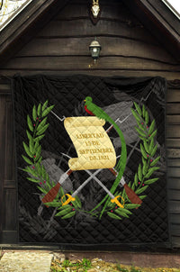 Black Guatemala quilt with quilted texture, central emblem banner, parrot and laurel