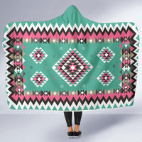 Large teal hooded blanket with central diamond geometric motif, pink and black accents
