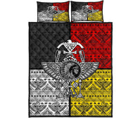 Front view quilt bed set with thunderbird emblem and banded tribal patterns in red, black, yellow