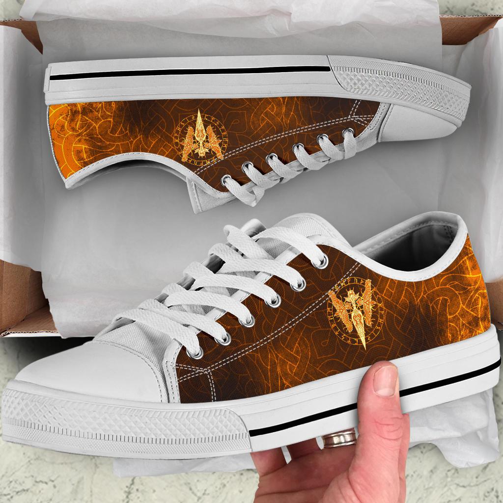 Viking low-top sneakers with white laces, white sole, orange-brown upper and gold spear/ravens