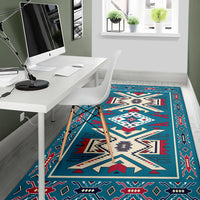Teal Native American area rug with red, white and cream lightning-and-motif design
