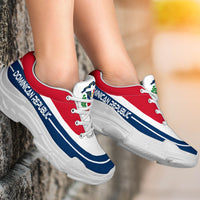 Dominican Republic chunky sneakers on feet, red and white with blue stripes, white sole