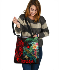 Black Polynesian tote with turtle and hibiscus flowers, red tribal swirls, shoulder carry.