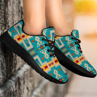 Turquoise patterned sport sneakers, black laces, chunky sole, worn side view