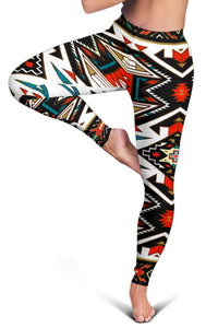 Close-up of colorful tribal geometric leggings with red star and diamond symbols
