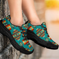 Blue patterned chunky sneakers on feet, black outsole, close side profile