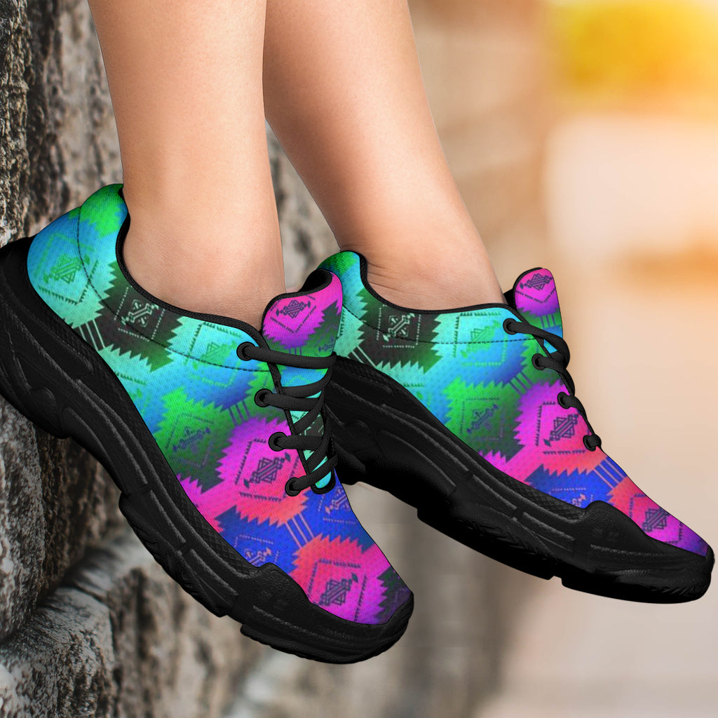 Chunky sneakers on feet, Native geometric print in turquoise, pink, and blue; black sole