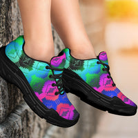 Chunky sneakers on feet, Native geometric print in turquoise, pink, and blue; black sole