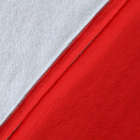 Premium blanket fabric close-up, red with white underside and smooth woven texture