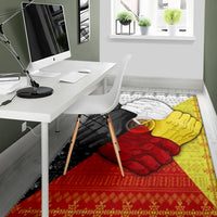 Medicine wheel hand area rug with red and yellow hands over black-and-white patterned design