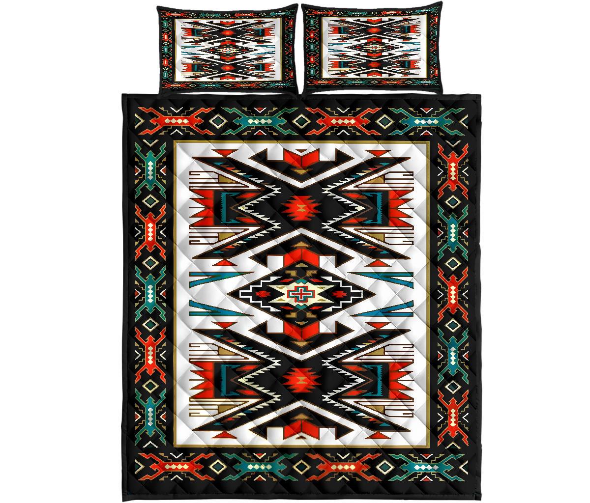 Flat-lay view of colorful tribal geometric quilt with two matching square shams