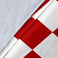 Close-up of red-and-white checker pattern on the Croatia blanket fabric