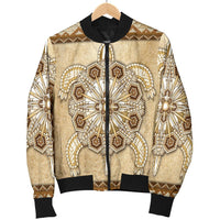 Tan bomber jacket on wooden hanger; black zipper, beaded central heart motif