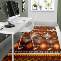Brown area rug with southwestern arrows, diamond pattern, and small white birds
