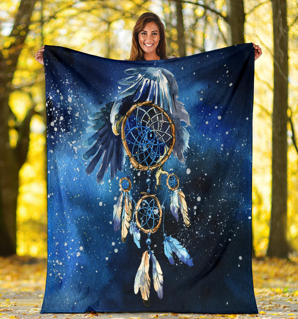 Blue galaxy dreamcatcher blanket held open, multi-ring motif with blue feather accents