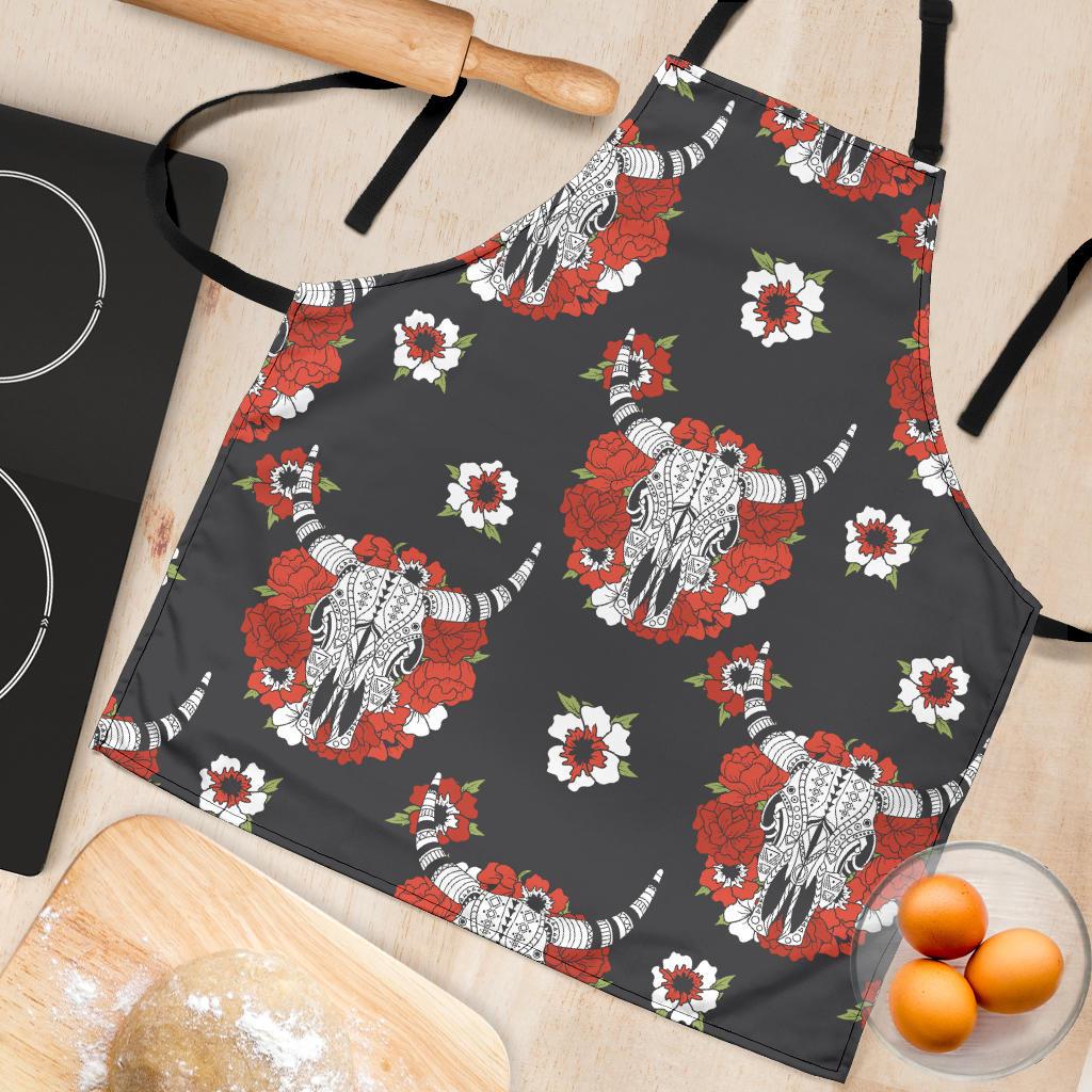 Close-up apron fabric: dark gray with red roses, white daisies, and white bull head print
