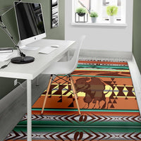 Multicolor bison area rug with tribal geometric bands and zigzag edge pattern.