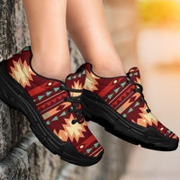 Red geometric pattern chunky sneakers on legs, black sole and black lace-up