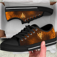 Viking low-top sneakers with black laces, black sole, orange-brown upper and gold spear/ravens