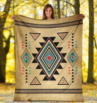 Tan Southwest symbol throw blanket with bold starburst center and red, teal, and black details