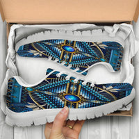 Boxed blue multicolor sneakers, close-up of laces and beaded pattern uppers