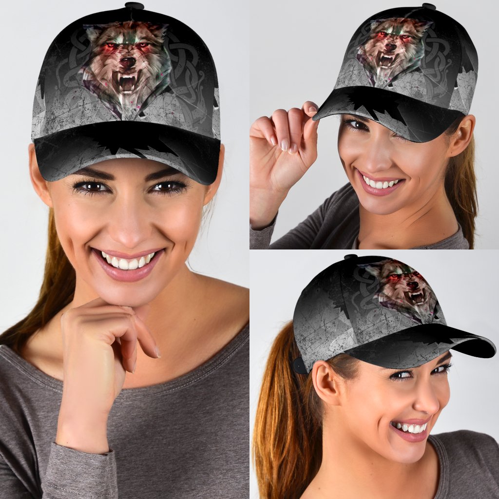 Black and grey baseball cap with wolf graphic, worn by smiling woman