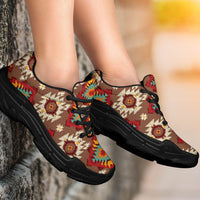 Red/green geometric printed tan sneakers with black laces and cushioned black sole