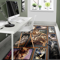 Multicolor wolf patchwork area rug with framed wolves, dark border, and central wolf panel
