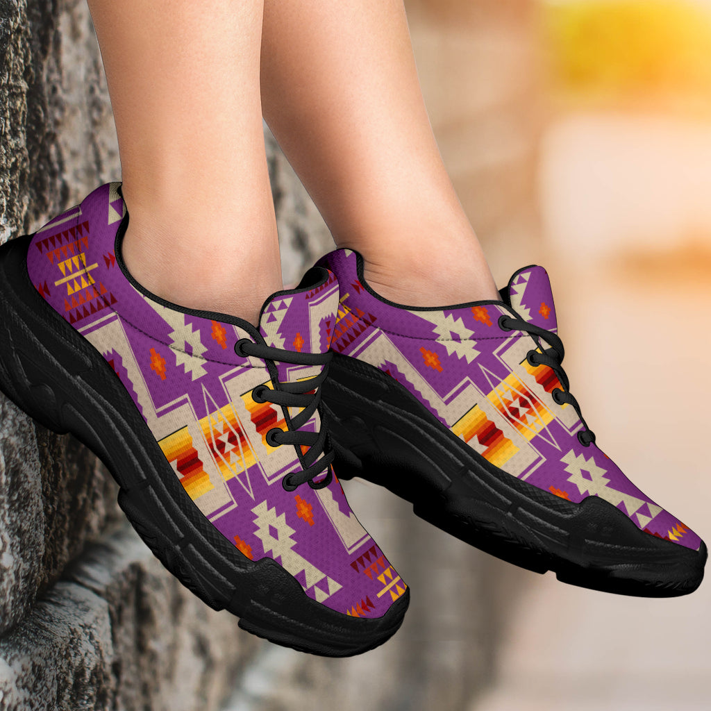 Light purple tribal print sneakers on foot, black chunky sole and lace-up front