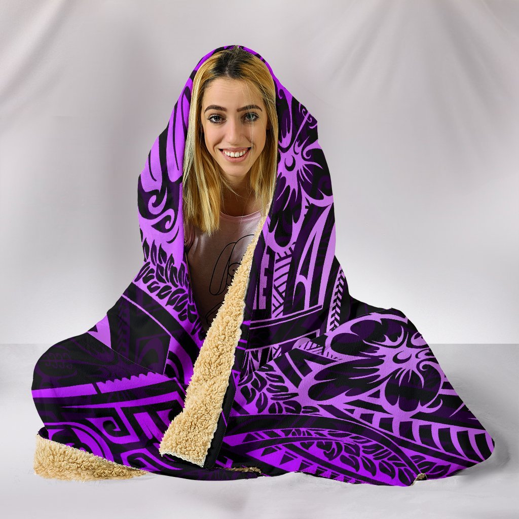Purple hooded blanket close-up with neon-lilac Polynesian turtle print and bold swirls