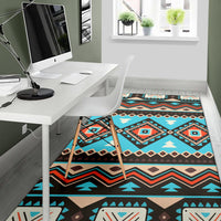 Turquoise geometric tribal area rug runner style under a desk and chair