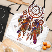 White apron flat lay showing multicolor dreamcatcher circle, feathers, stars and keys