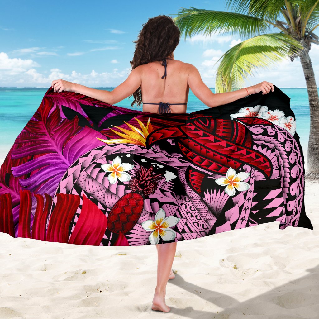 Hawaiian sarong spread out, red/purple tropical print with banana leaf colors and turtle design