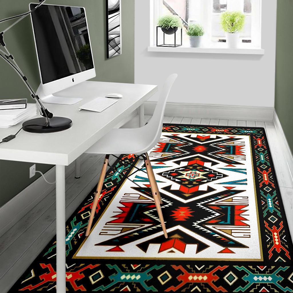Native geometric area rug in black with white zigzag star and red, teal, green details