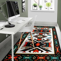 Native geometric area rug in black with white zigzag star and red, teal, green details
