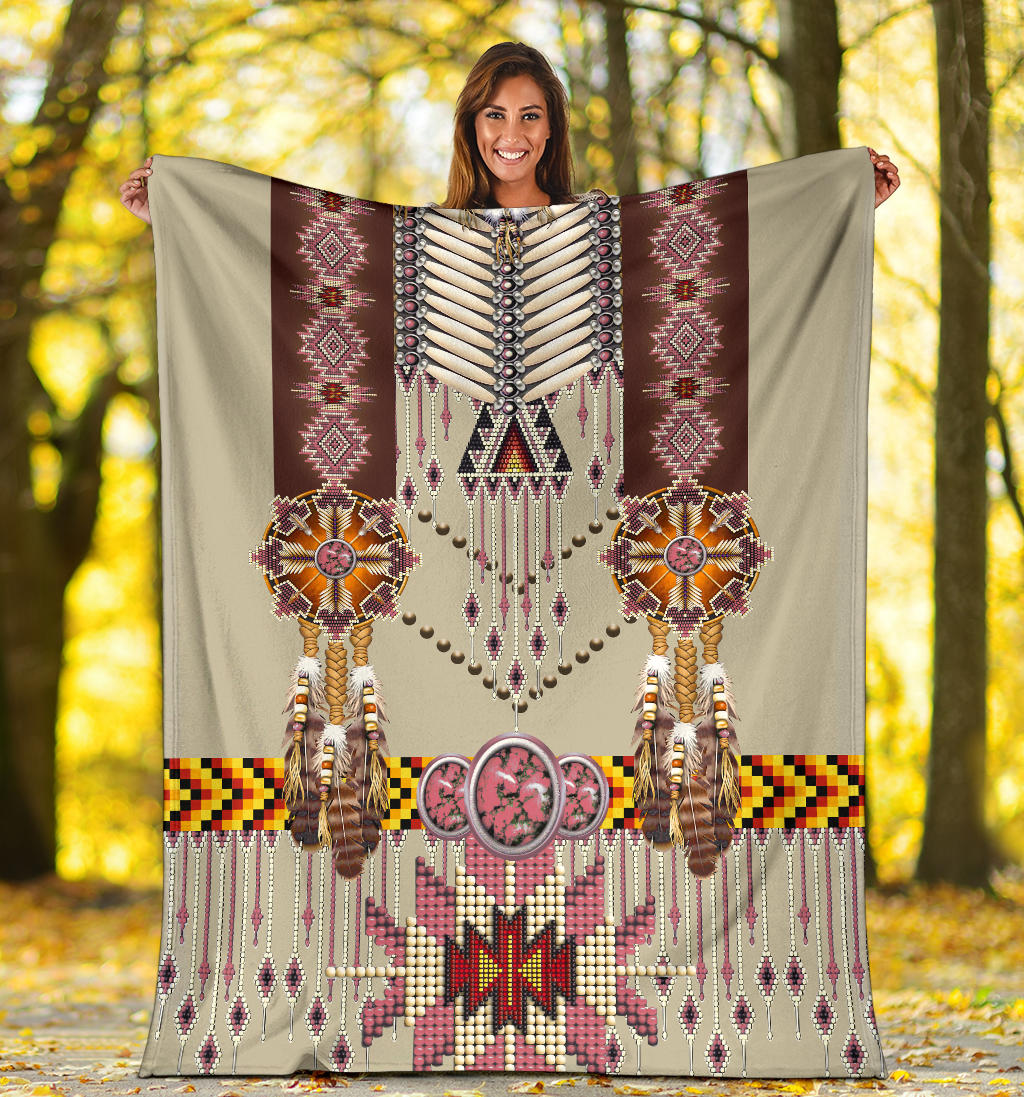Beige breastplate blanket held outdoors, showing beaded jewelry motif and pink star